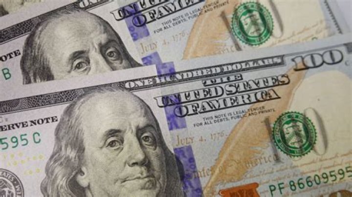 What is e100 in US dollars?